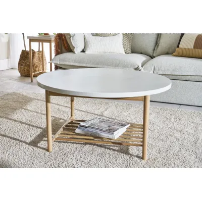 White Round Coffee Table with Lower Rack in Smooth Finish